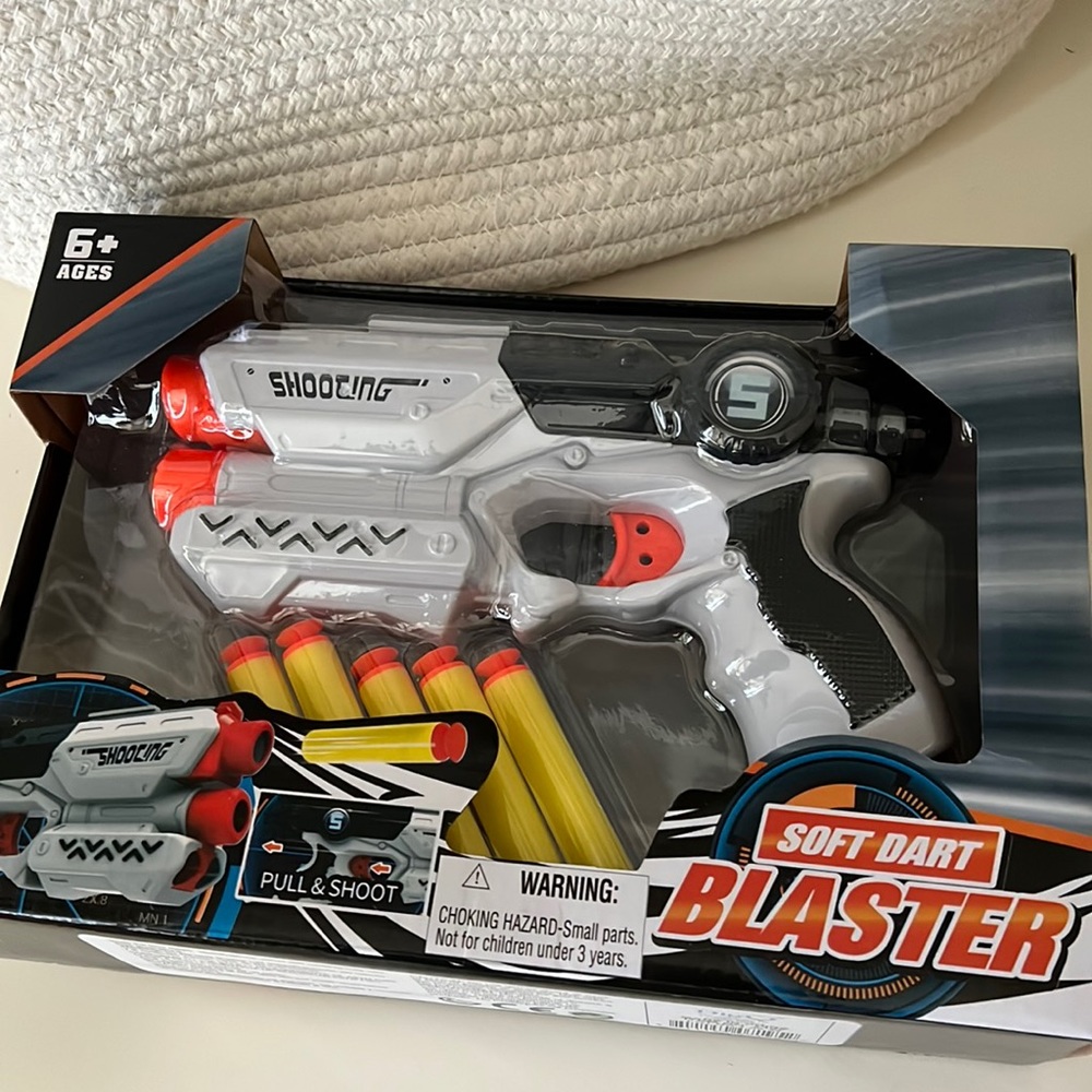 Toy dart gun. Brand new and never opened